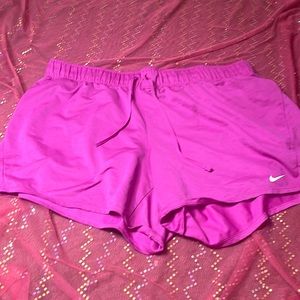 NIKE women’s fuchsia Dri Fit shorts